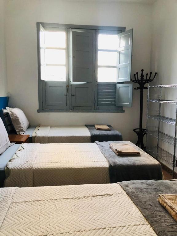 Postel nebo postele na pokoji v ubytování Rota BH Hostel