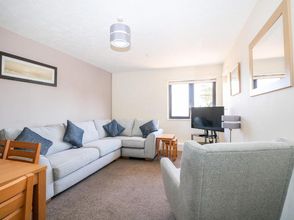 a living room with a couch and a tv at Flat 34 - Marine Court in Littlehampton