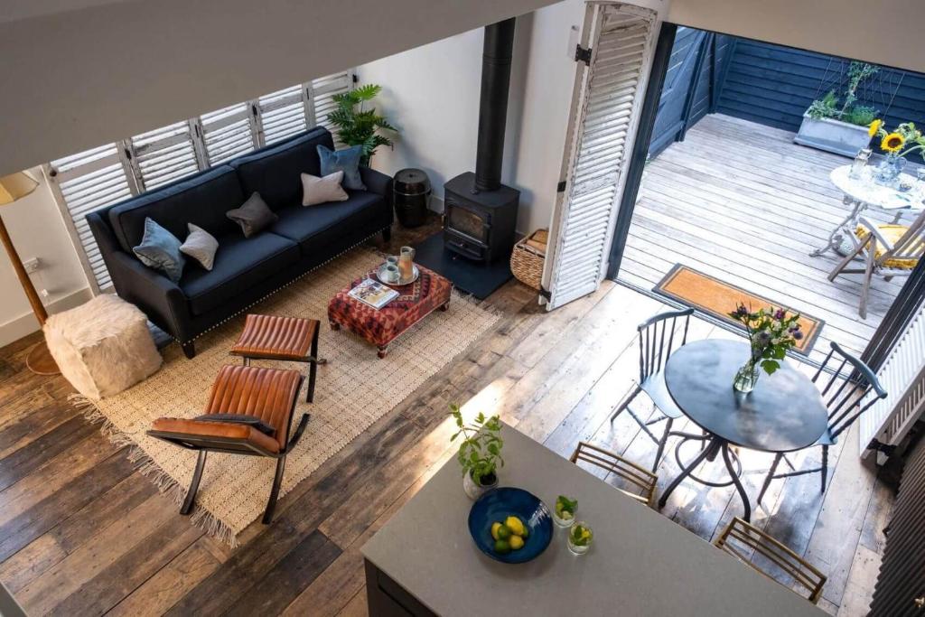 an overhead view of a living room with a couch and a table at The Little Gate House in Milford on Sea
