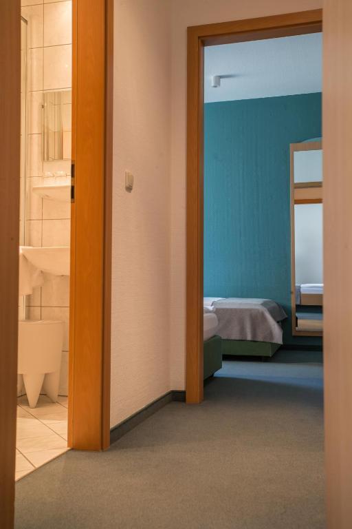 Postel nebo postele na pokoji v ubytování Hotel Gewürzmühle
