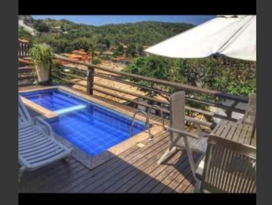 Utsikt mot bassenget på Casa em Geribá ampla duas suítes com piscina e vista dentro de condominio eller i nærheten