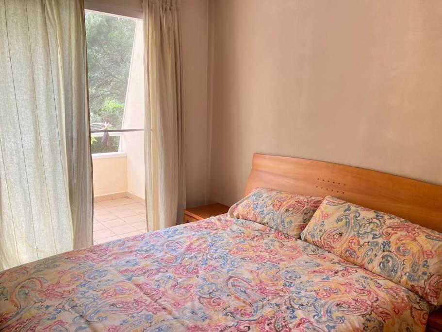 Säng eller sängar i ett rum på Acogedor chalet familiar en la Sierra Calderona