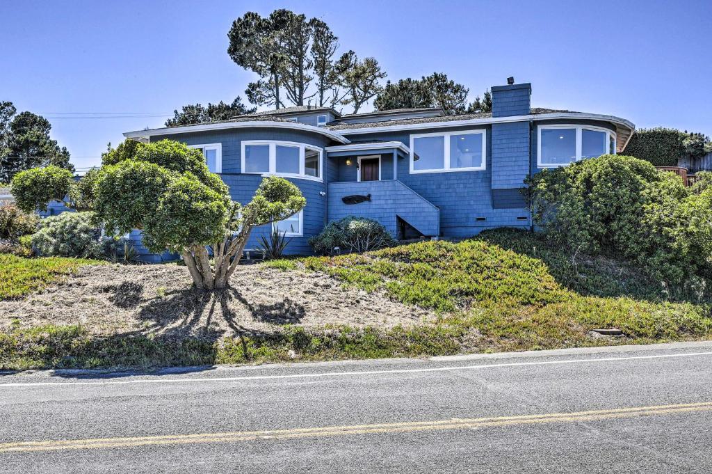 a blue house on the side of a road at Dreamy Sonoma Coast Home with Waterfront Views in Bodega Bay