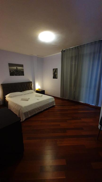 Postel nebo postele na pokoji v ubytování Nirvana House Pisa