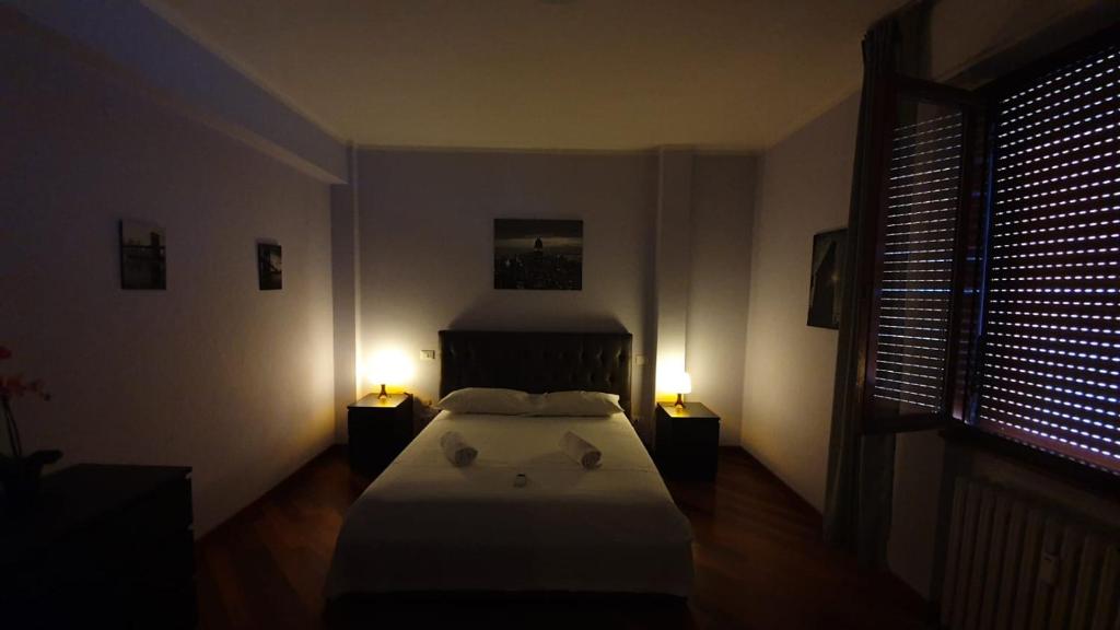 Postel nebo postele na pokoji v ubytování Nirvana House Pisa