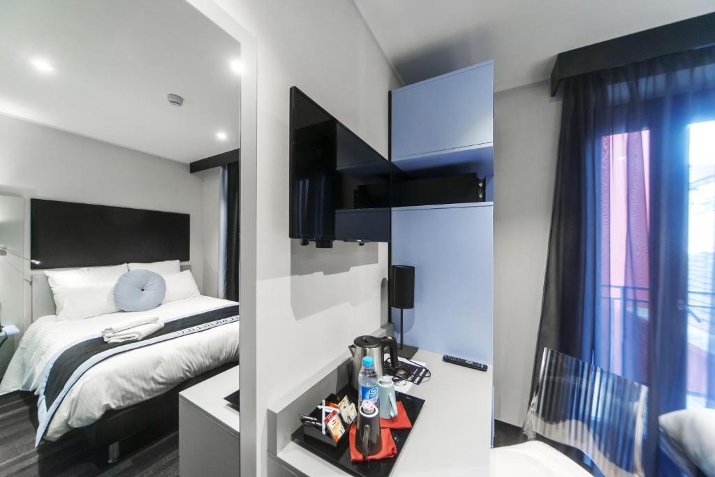 Postel nebo postele na pokoji v ubytování Hôtel Boutique Richelieu, Lyon Gare Part-Dieu