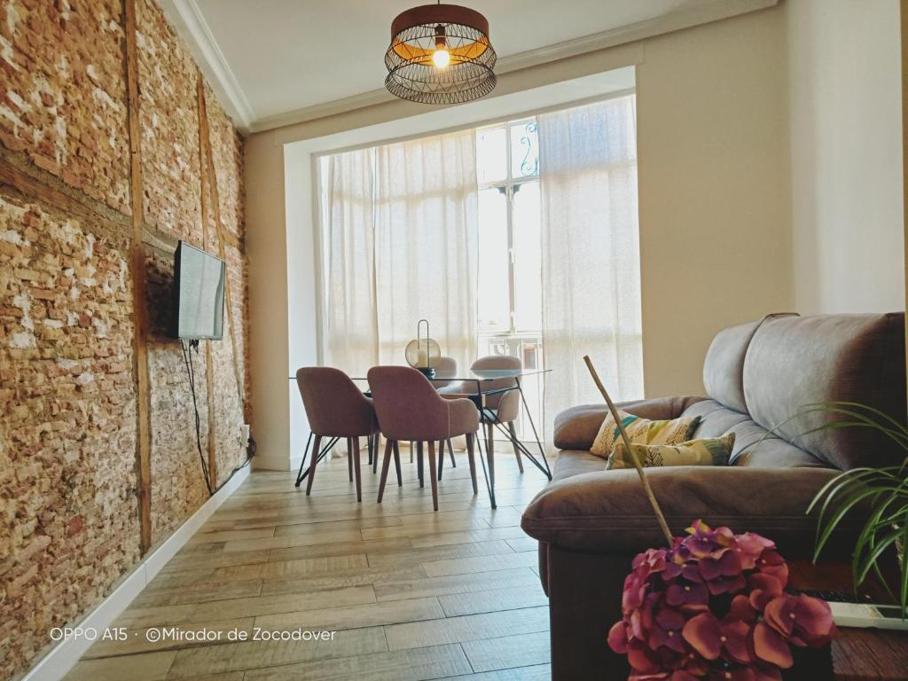 a living room with a couch and a table at Mirador de Zocodover in Toledo