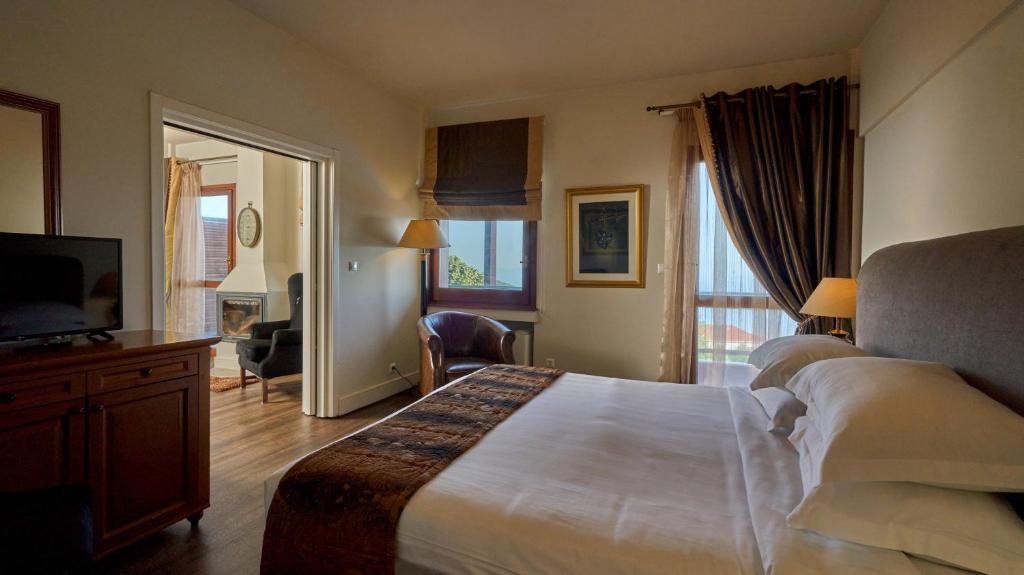 Postel nebo postele na pokoji v ubytování Xenia Palace Portaria