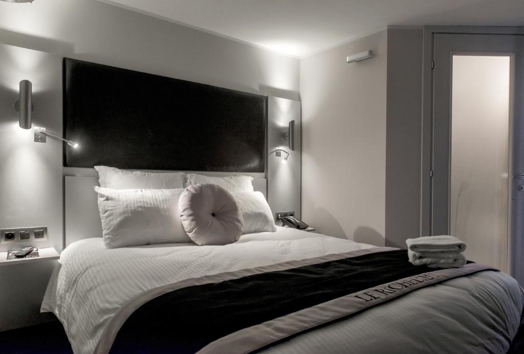 Postel nebo postele na pokoji v ubytování Hôtel Boutique Richelieu, Lyon Gare Part-Dieu