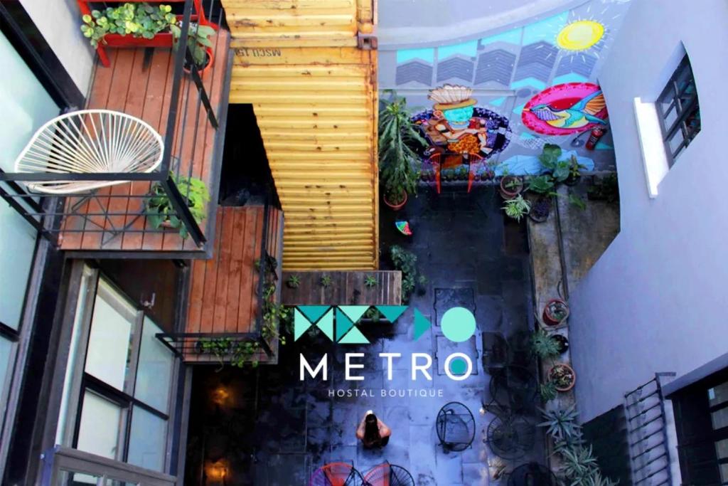 a building with a mello sign on the side of it at Metro Hostal Boutique in Mexico City