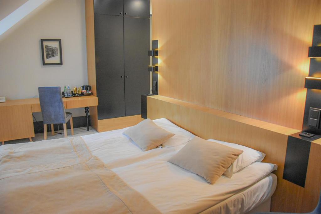 Postel nebo postele na pokoji v ubytování Hotel Nihil Novi