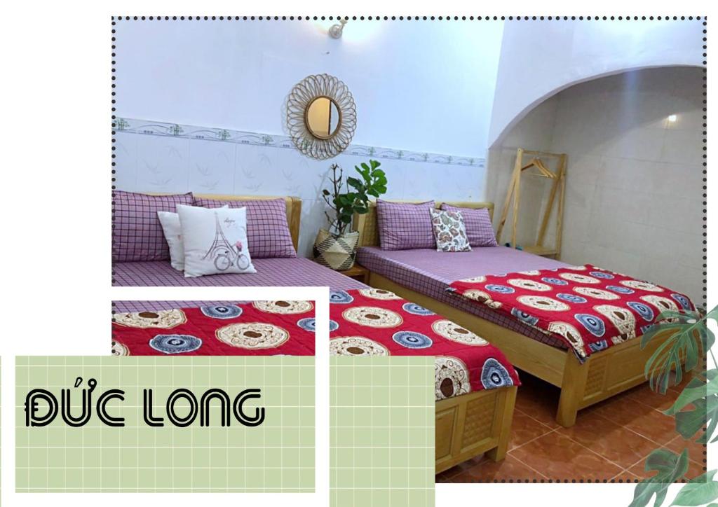 two beds sitting in a room with at Đức Long in Vung Tau