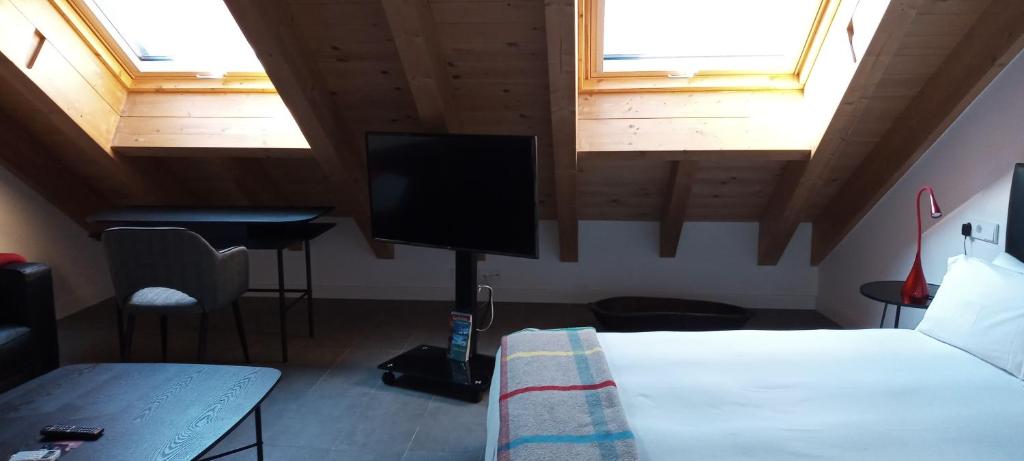 Postel nebo postele na pokoji v ubytování Slow León Apartamentos Turísticos