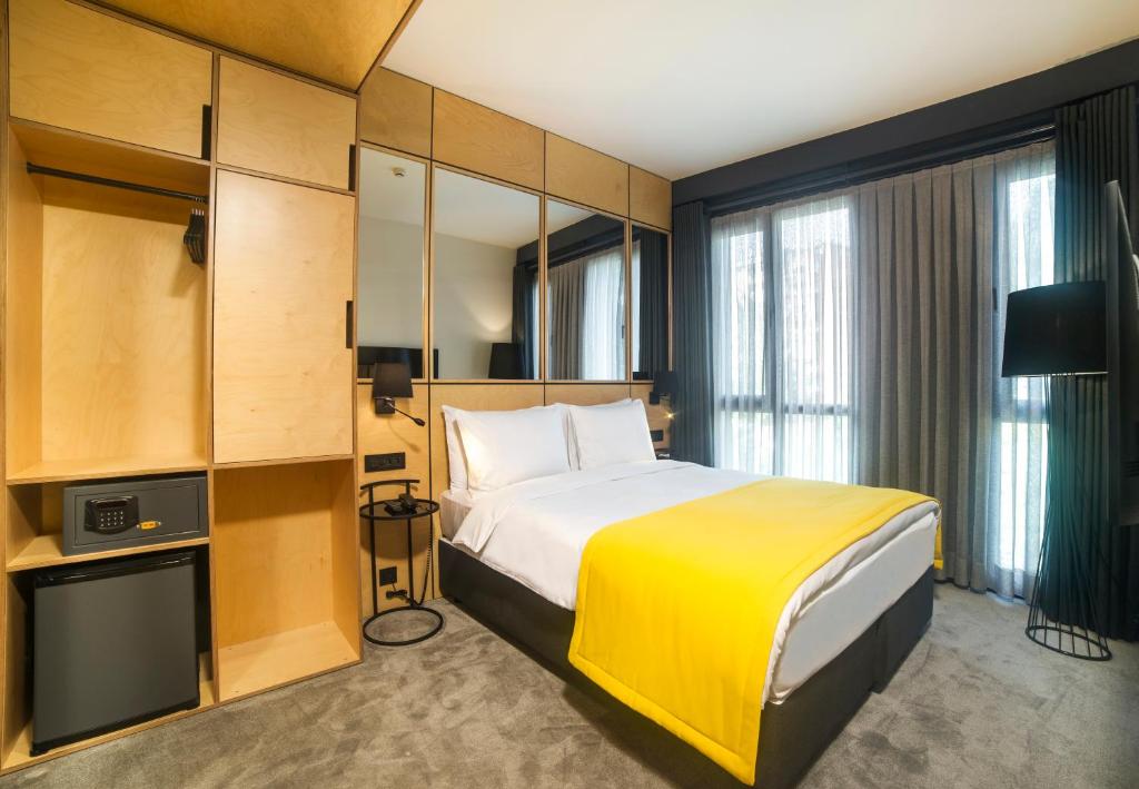 Säng eller sängar i ett rum på Trip Park Hotel
