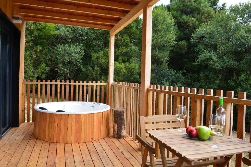A balcony or terrace at Cabañas Compostela - Cabaña Pedroso con bañera de hidromasaje