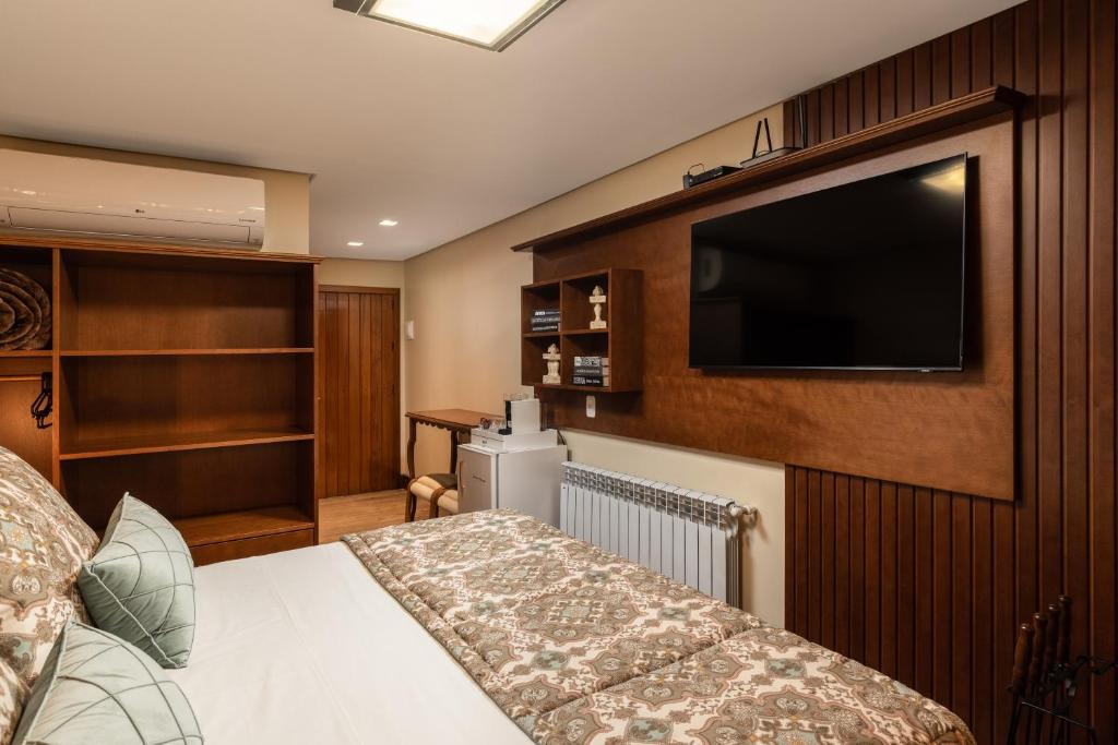TV a/nebo společenská místnost v ubytování Hotel Vivenda dos Sonhos