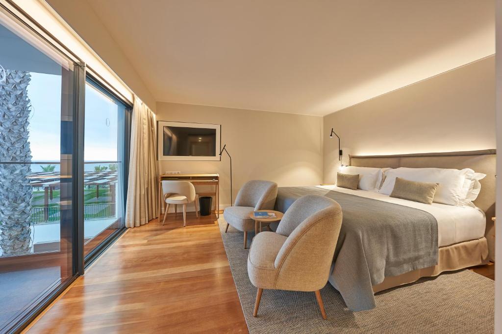 Ένα ή περισσότερα κρεβάτια σε δωμάτιο στο La Villa at The Cliff Bay - PortoBay