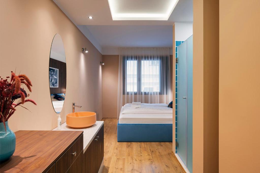 Postel nebo postele na pokoji v ubytování SWU Magazine Rooms