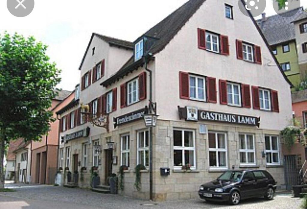 a car parked in front of a building at Gasthaus Lamm in Waldenbuch