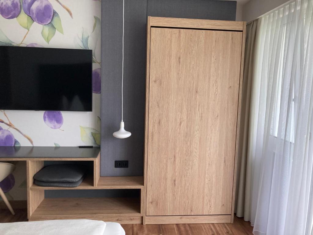 TV a/nebo společenská místnost v ubytování Obstgarten Gästehaus