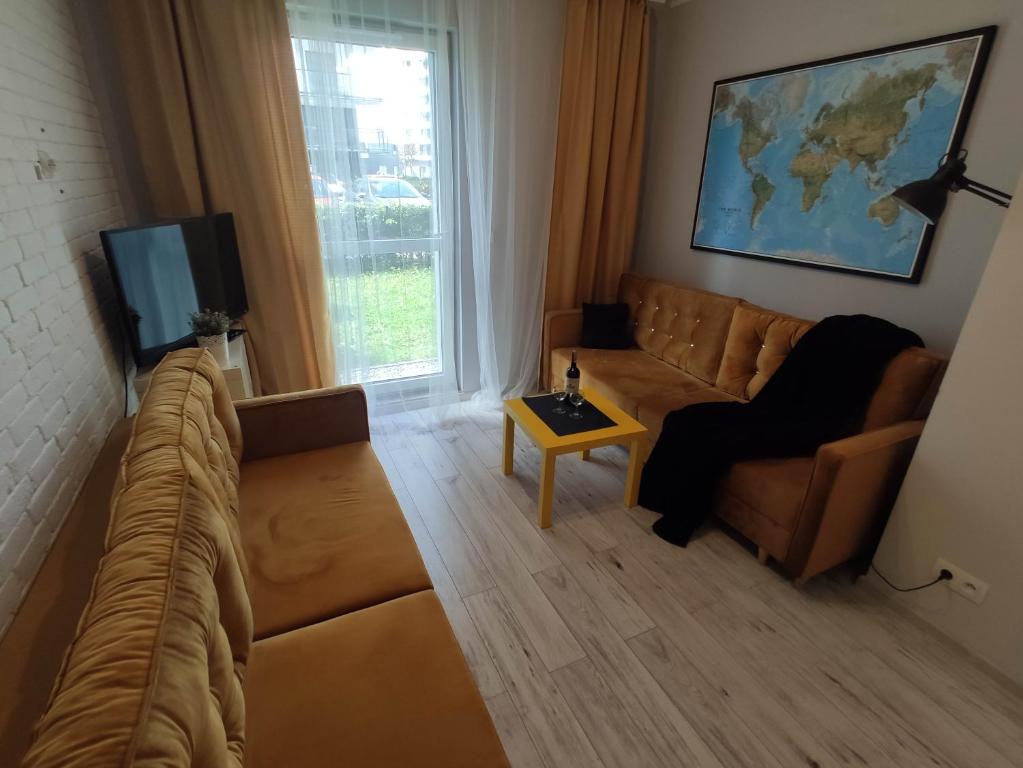 Televízia a/alebo spoločenská miestnosť v ubytovaní Black House