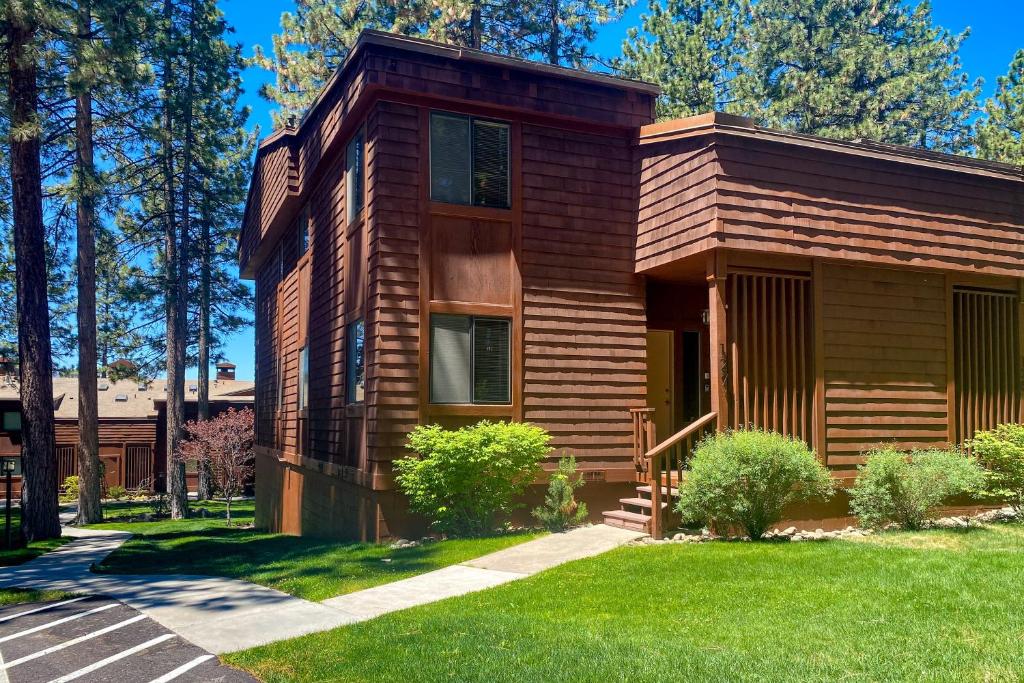 a wooden house with a lawn in front of it at Tahoe Enchantment in Zephyr Cove
