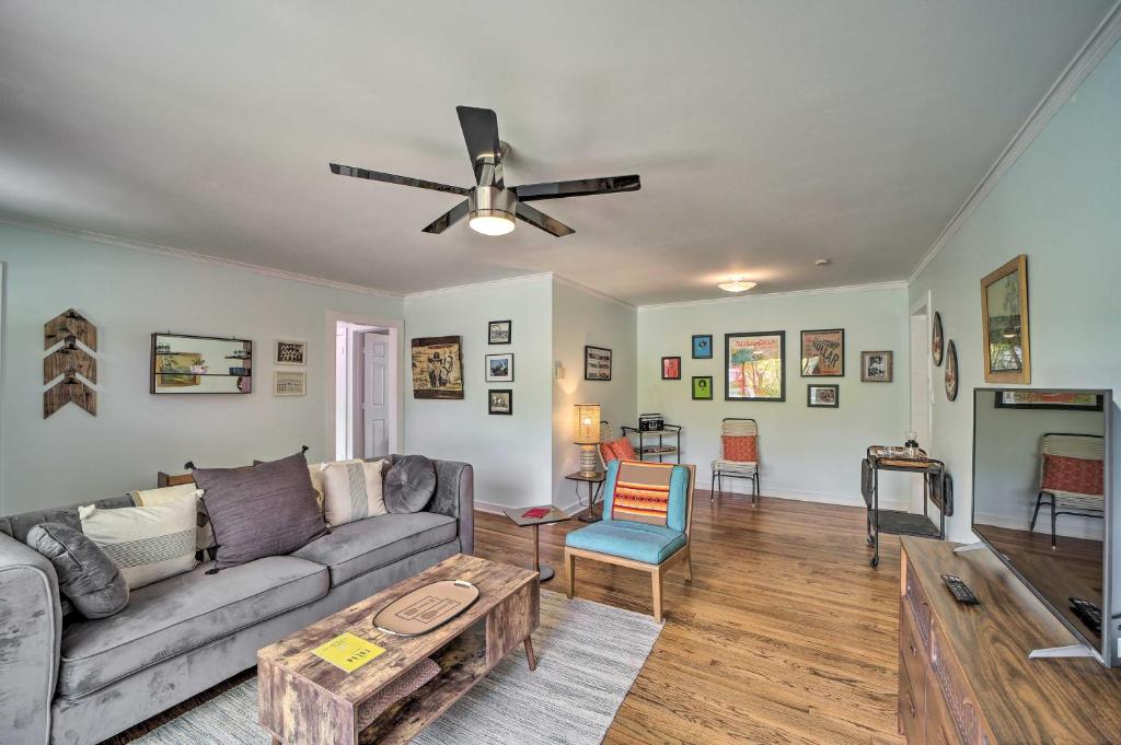 a living room with a couch and a ceiling fan at Tulsa Family Home with Yard Less Than 6 Mi to Downtown! in Tulsa