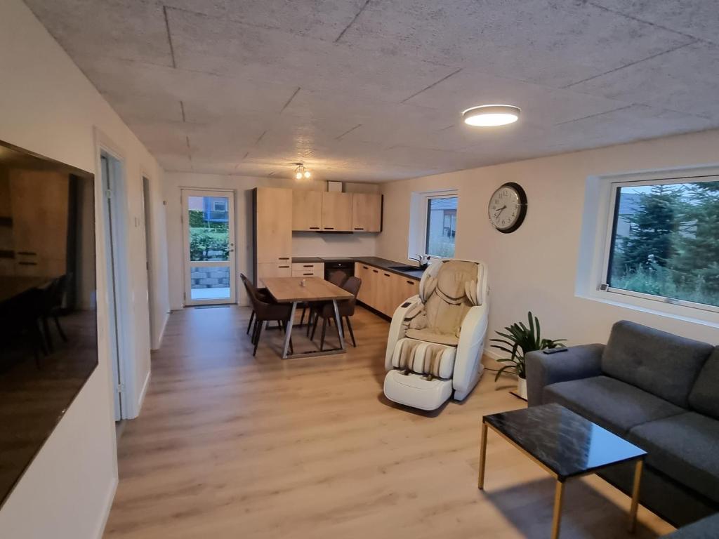 a living room with a couch and a table at Bonico in Horsens