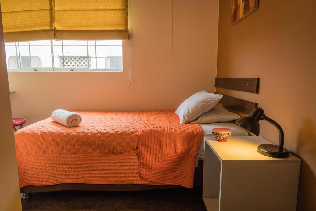 Postel nebo postele na pokoji v ubytování B&B Wasi Airport Lima
