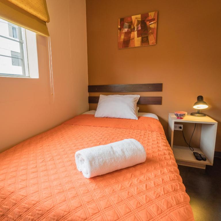 Postel nebo postele na pokoji v ubytování B&B Wasi Airport Lima