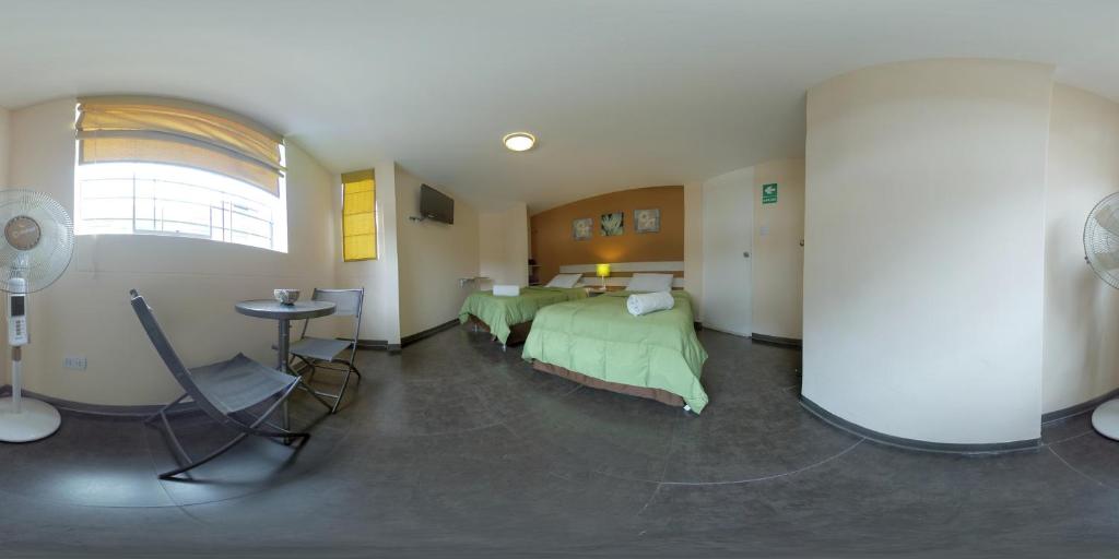Postel nebo postele na pokoji v ubytování B&B Wasi Airport Lima