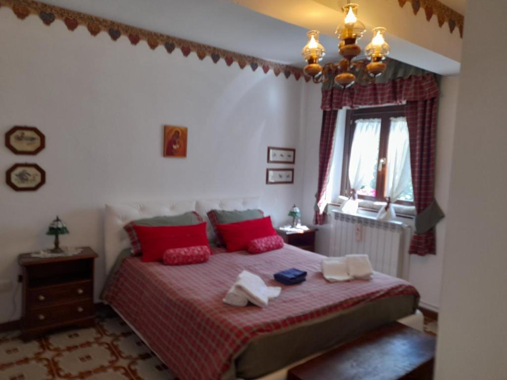 Postel nebo postele na pokoji v ubytování Casa vacanze Daniela