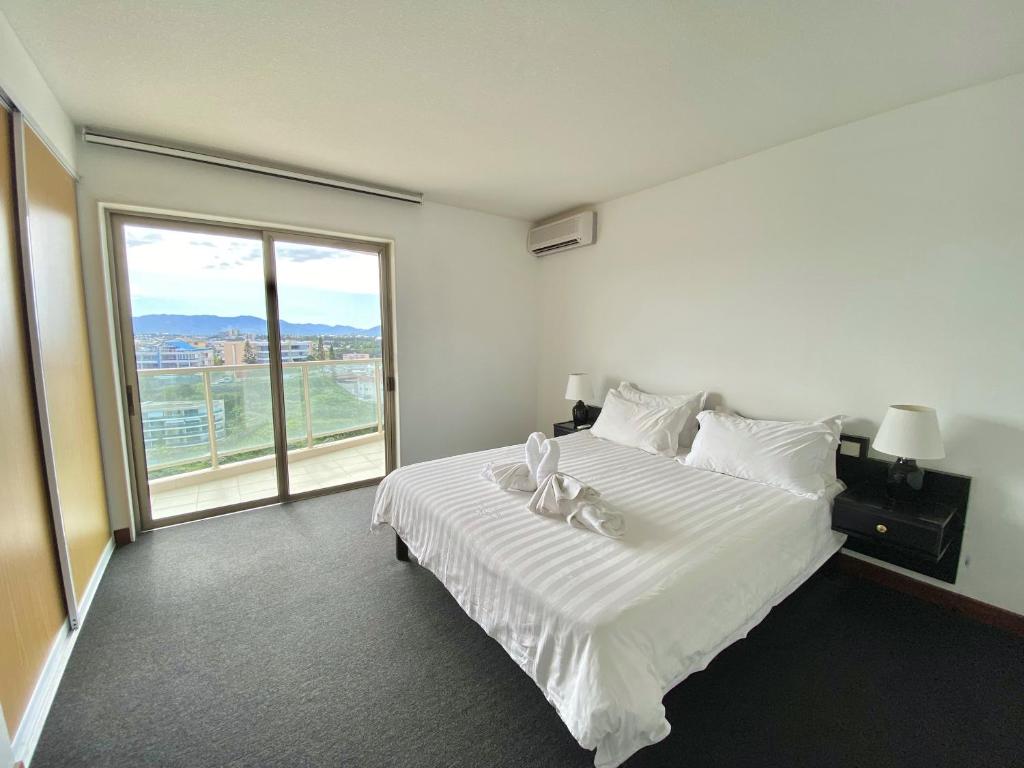 Postel nebo postele na pokoji v ubytování Casa Del Sole Apartments