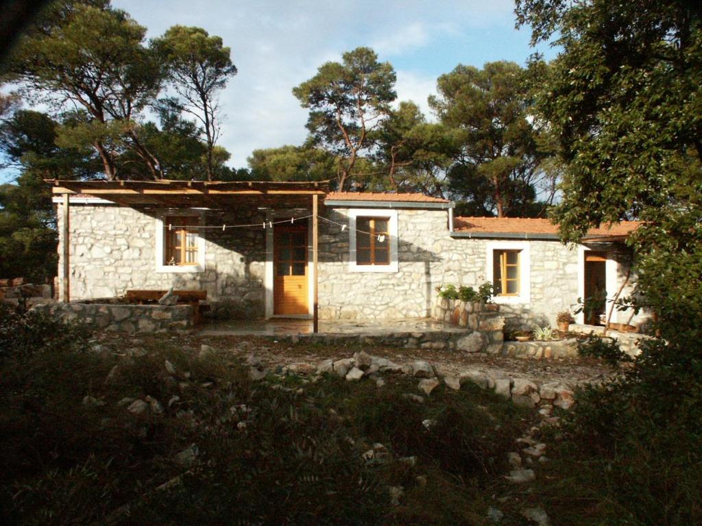 a stone house in the middle of a forest at Apartments by the sea Pomena, Mljet - 614 in Pomena
