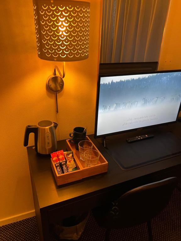 TV a/nebo společenská místnost v ubytování Noah Longstay