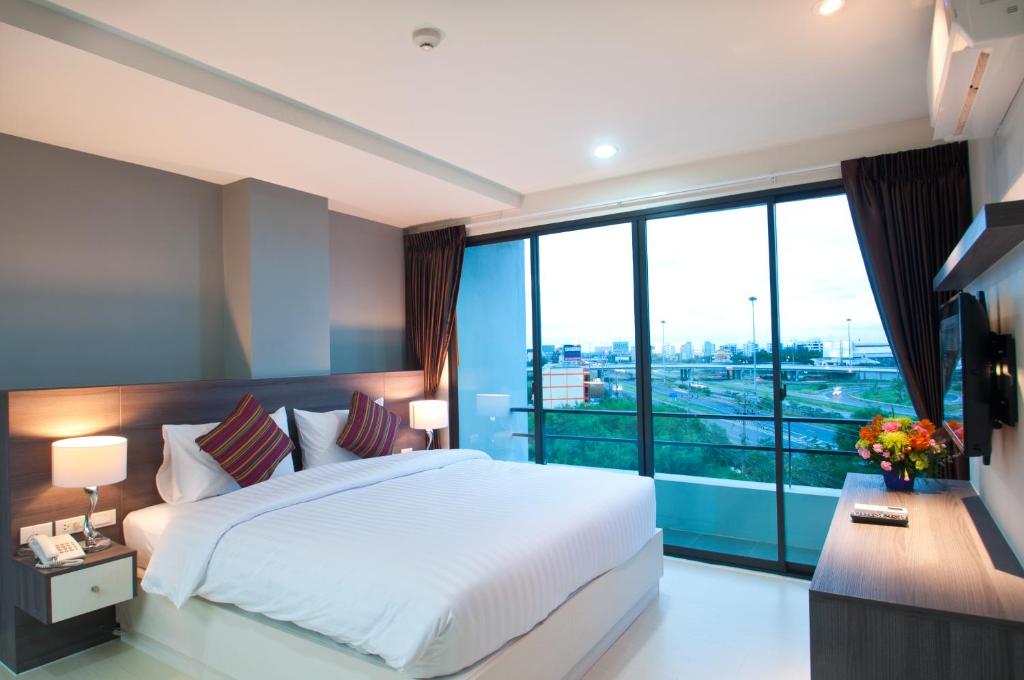 Postel nebo postele na pokoji v ubytování VC Residence - Chon Buri
