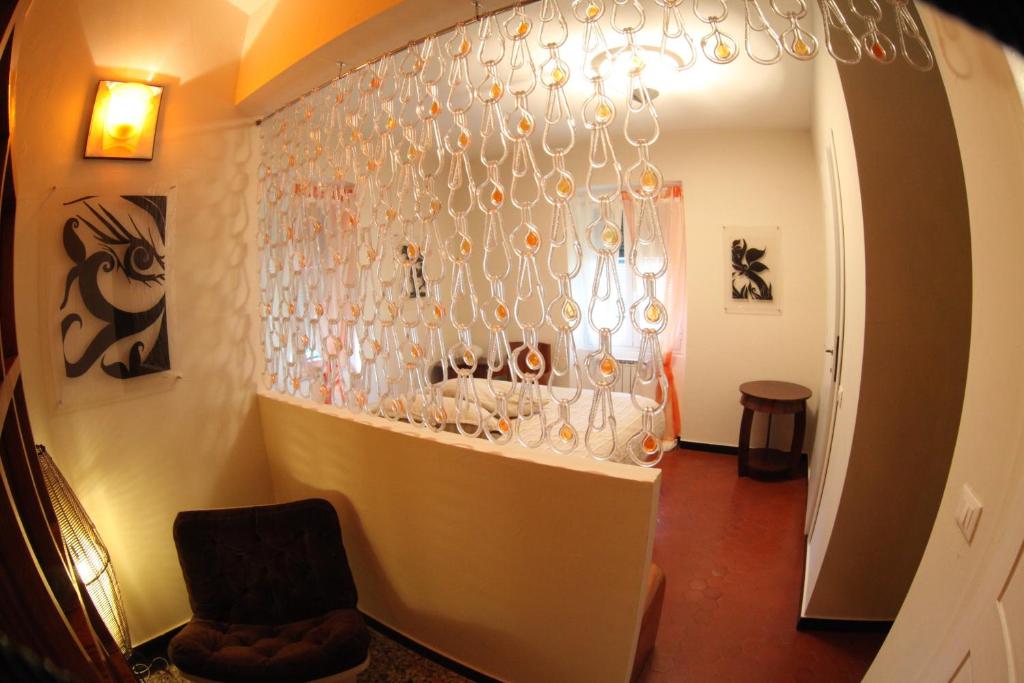 a room with a wall with glasses on it at BBQ Lodge in Camogli
