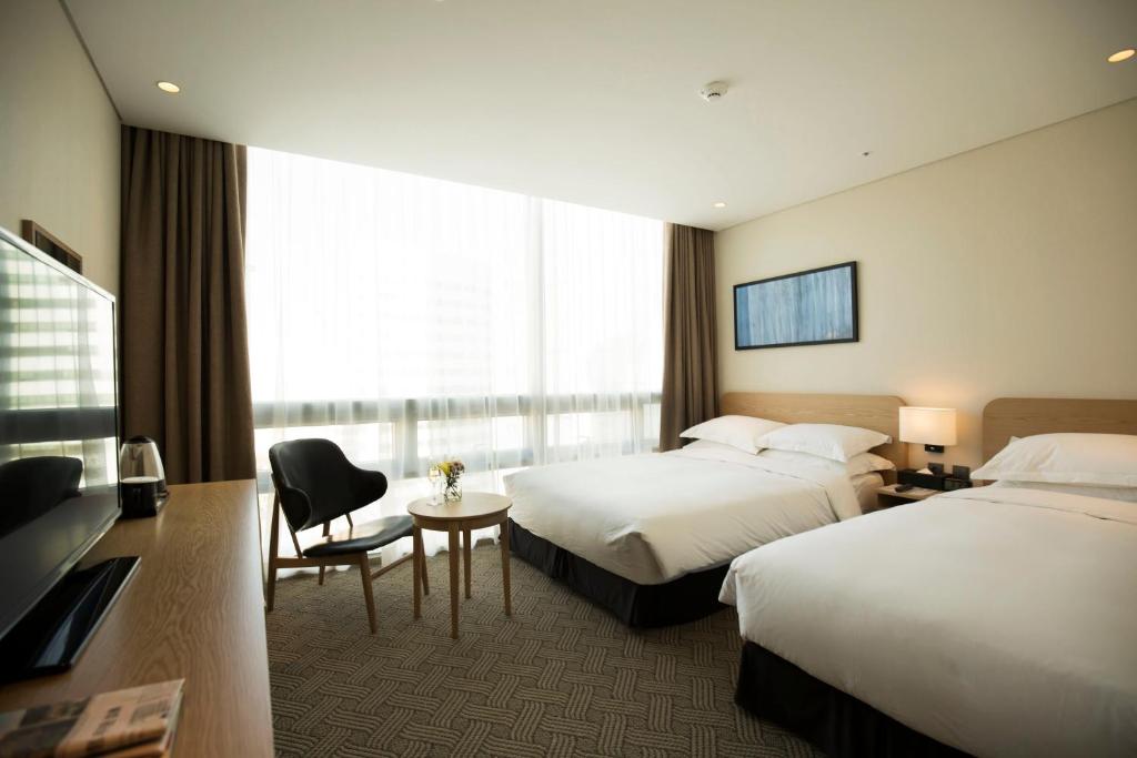 TV a/nebo společenská místnost v ubytování Best Western Haeundae Hotel