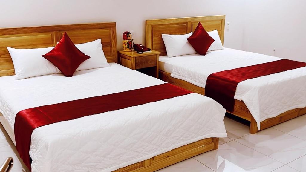 Postel nebo postele na pokoji v ubytování SUNRISE Hotel Vũng Tàu