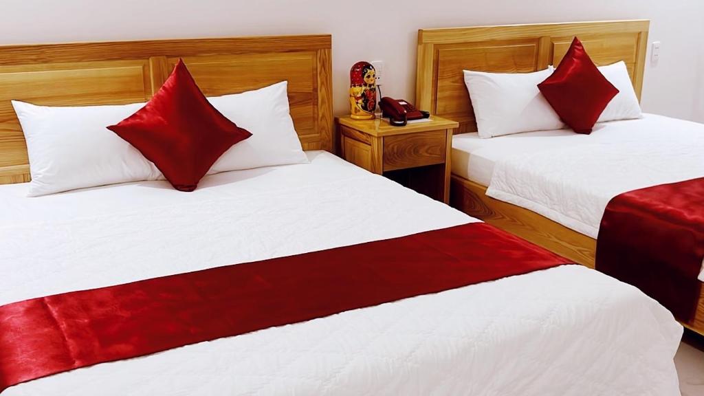 Postel nebo postele na pokoji v ubytování SUNRISE Hotel Vũng Tàu