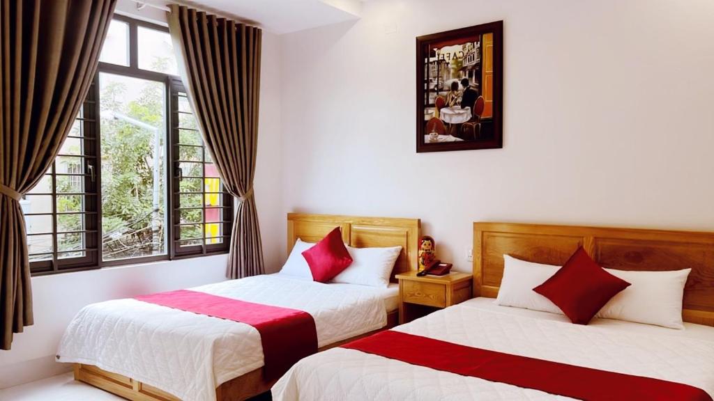 Postel nebo postele na pokoji v ubytování SUNRISE Hotel Vũng Tàu