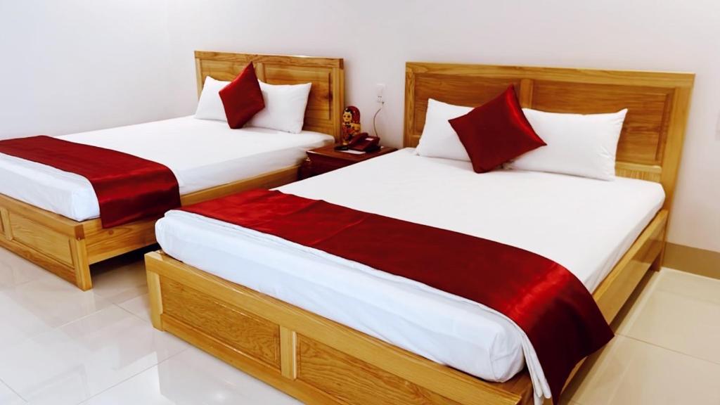 Postel nebo postele na pokoji v ubytování SUNRISE Hotel Vũng Tàu