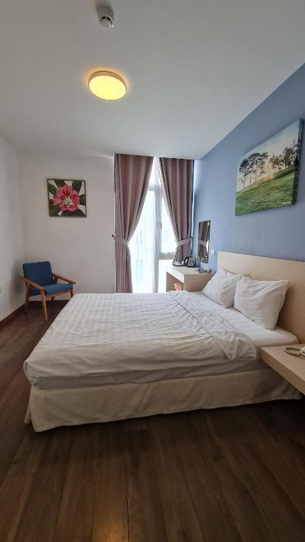Postel nebo postele na pokoji v ubytování Ngan Hoa - Mille Fleurs