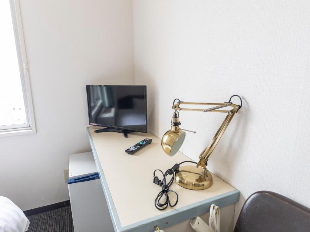 TV a/nebo společenská místnost v ubytování Tabist HotelArflex Tokuyama Station