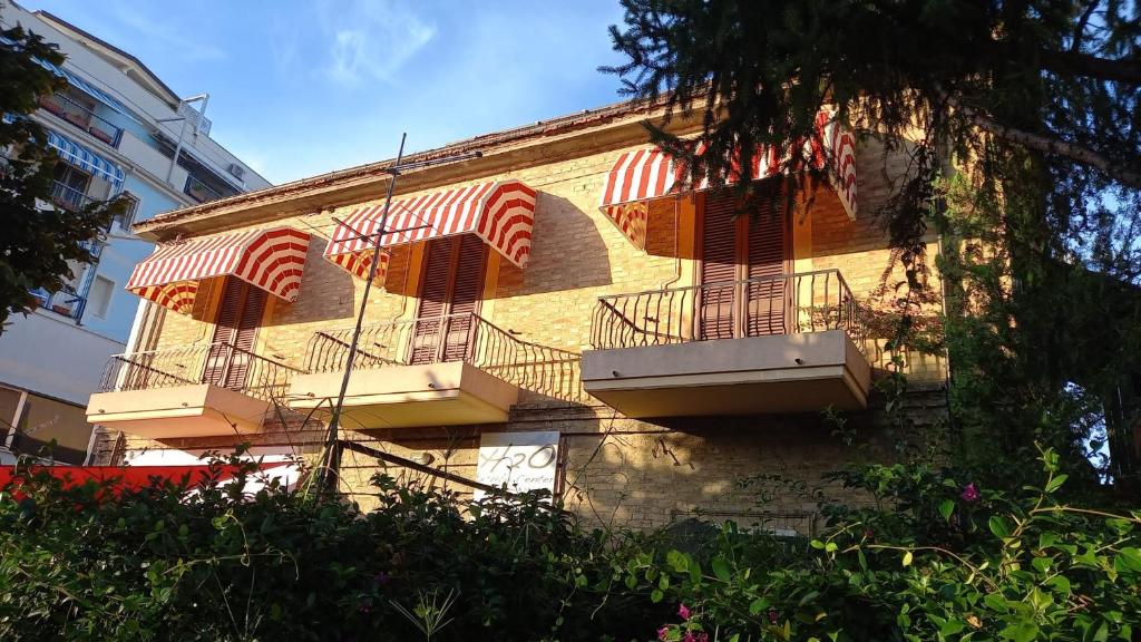 a building with balconies on the side of it at Casa Drema - Villa al mare con terrazza in Pescara