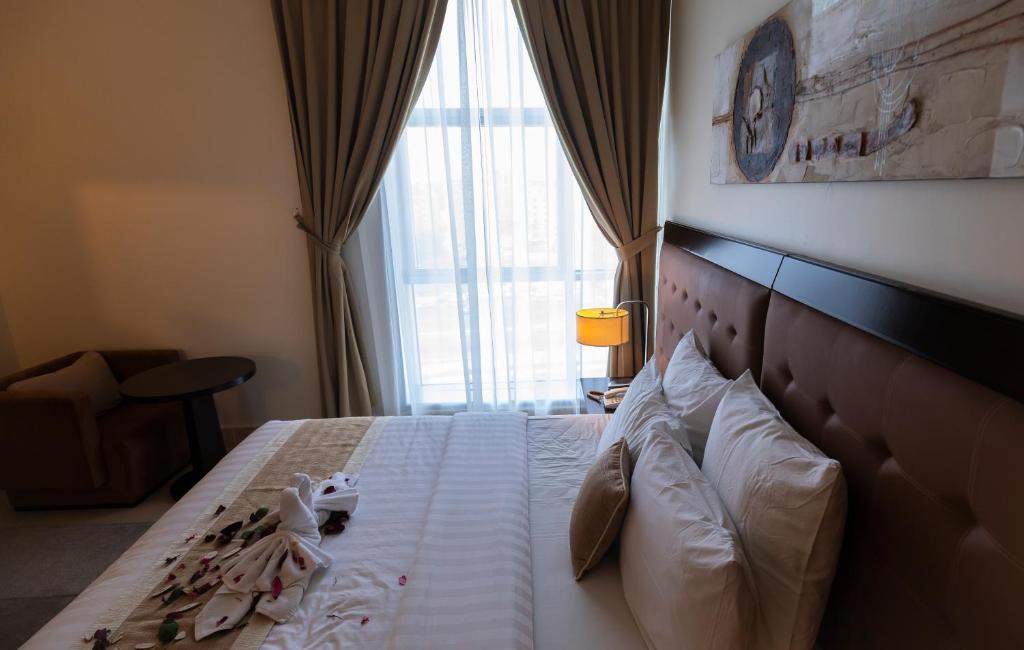 Ένα ή περισσότερα κρεβάτια σε δωμάτιο στο Imperial Suites Hotel