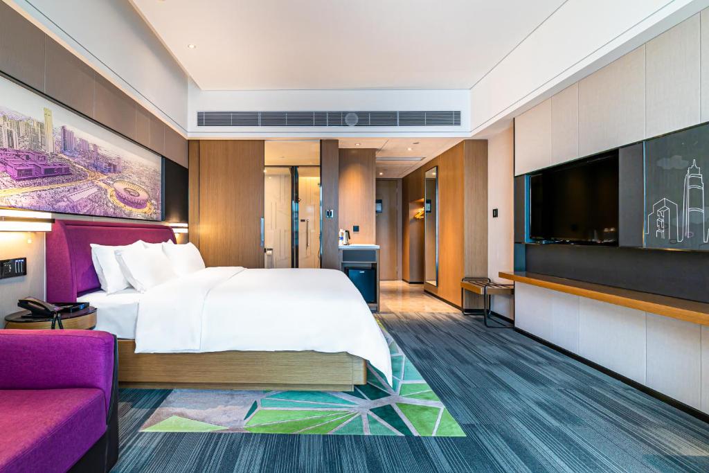 TV a/nebo společenská místnost v ubytování 佛山敏卓酒店Mentor Hotel