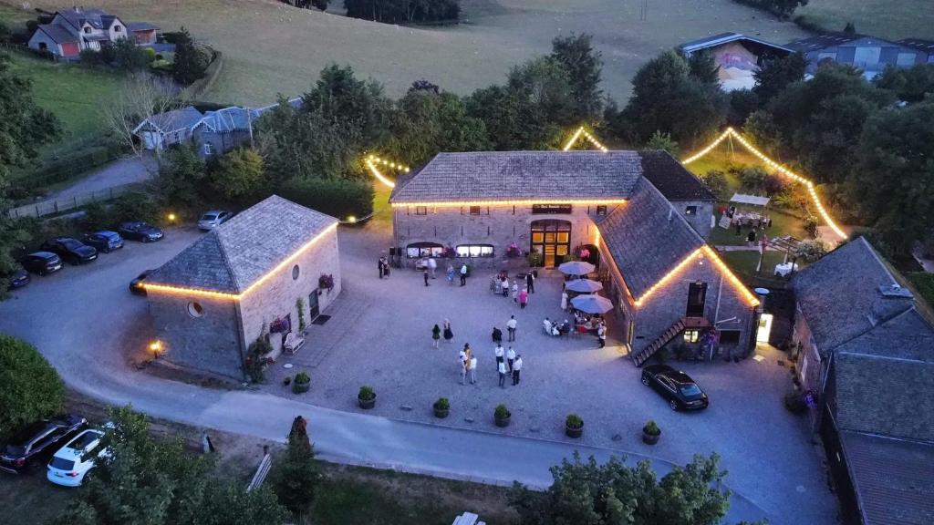 an aerial view of a building with people standing outside at Black Mountain Lodge in Glasbury