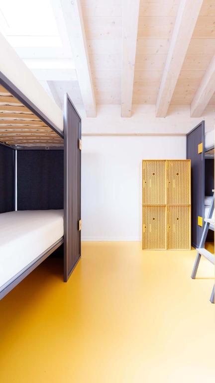 Łóżko lub łóżka w pokoju w obiekcie Nomad Hostel