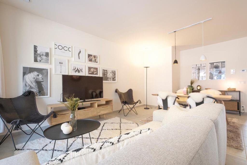 a living room with a couch and a table at The Erasmus Flats in Brussels